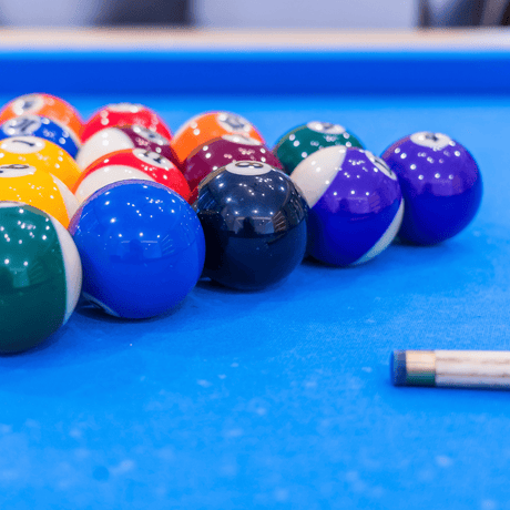 Image of stack balls in a blue pool table - Home Games Room