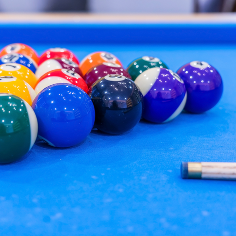 Image of stack balls in a blue pool table - Home Games Room